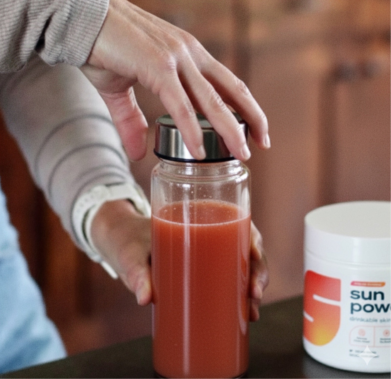 Sun Powder mixed in a bottle next to a tub